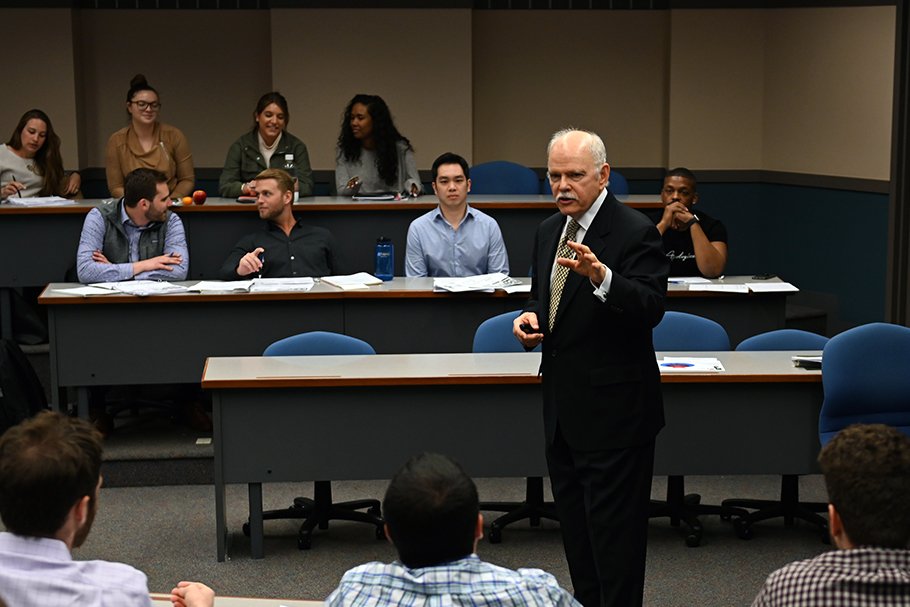 Business professor speaking to class