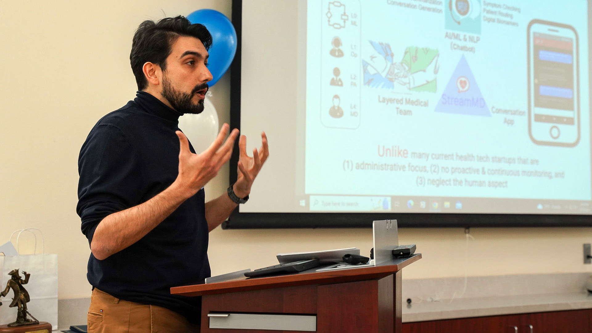 Sina Ansari, assistant professor of management and entrepreneurship at DePaul, pitches his business as a participant in the 2023 Social Impact Incubator.