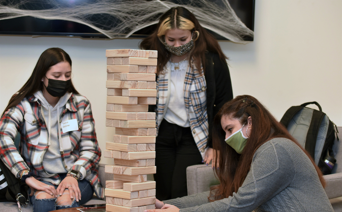 Students play Jenga at the 2nd Annual Marketing Careers Tricks & Treats event on Thursday, Oct. 28.