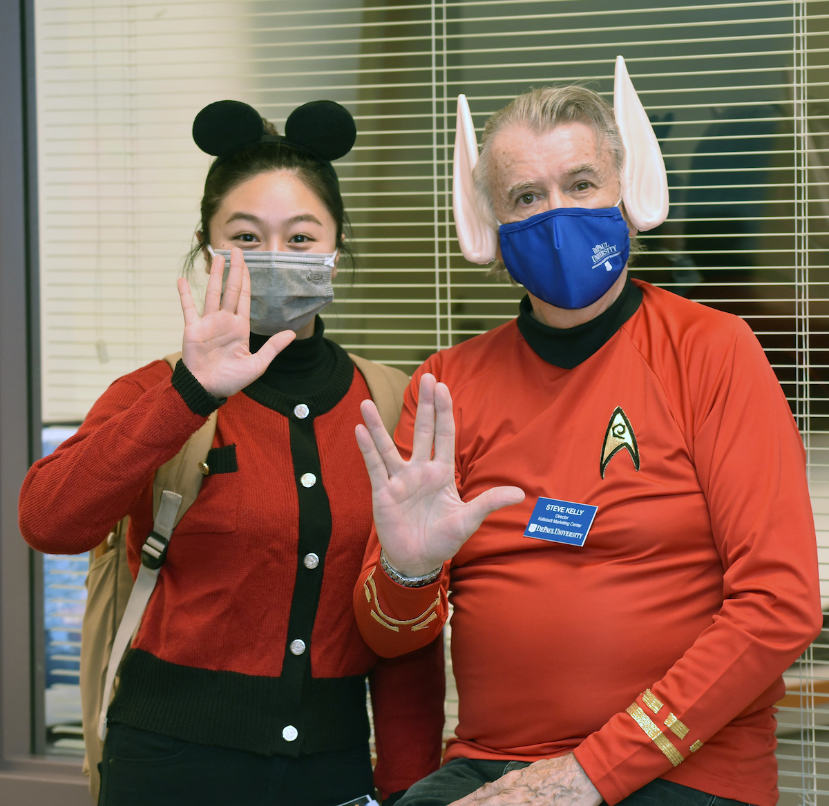 Student worker Ly Bui and Associate Professor Steve Kelly encourage students to live long and prosper at this year's Department of Marketing Halloween-themed career event.