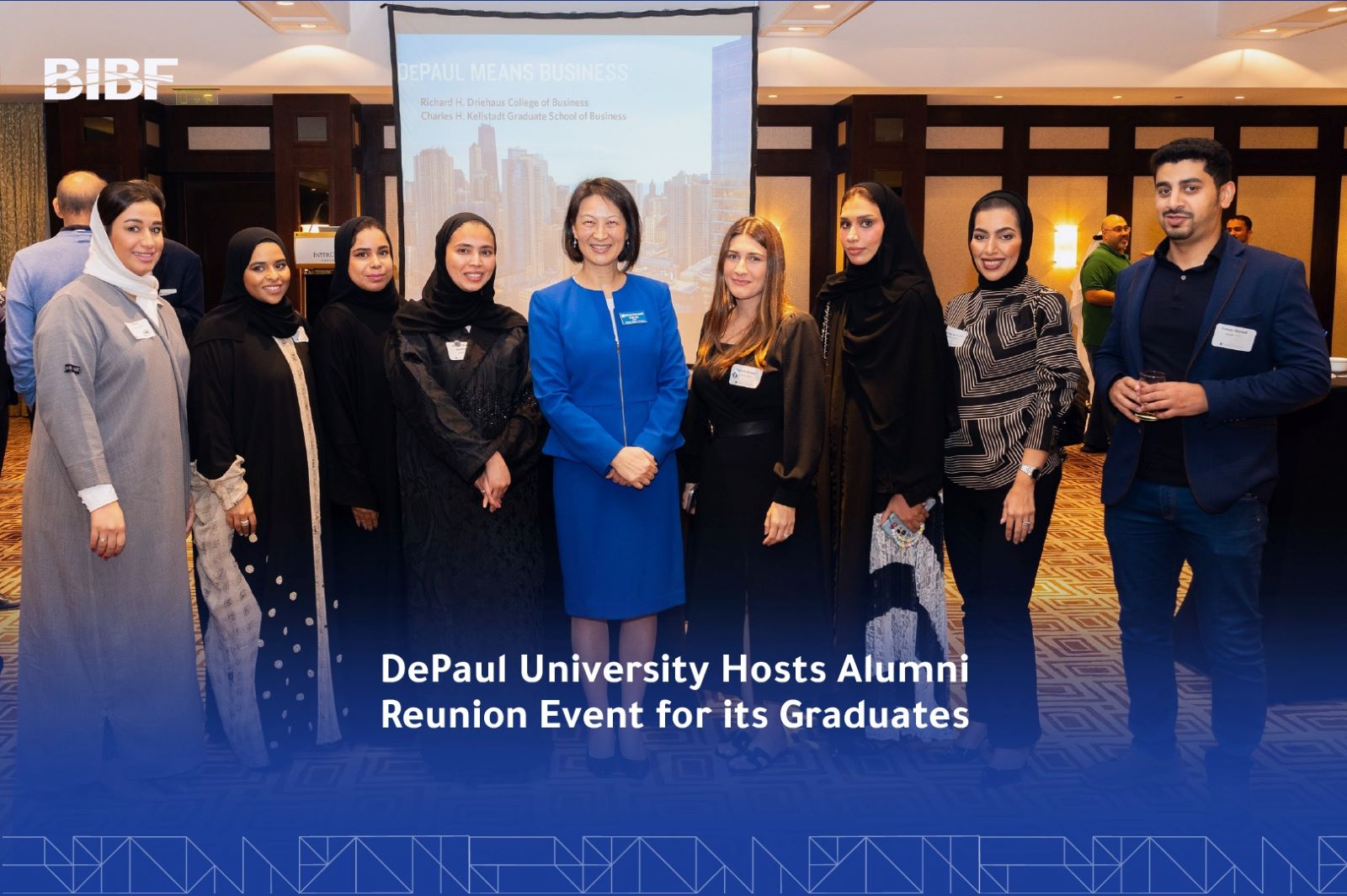 A group of students pose for a photo with DCOB Dean Sulin Ba