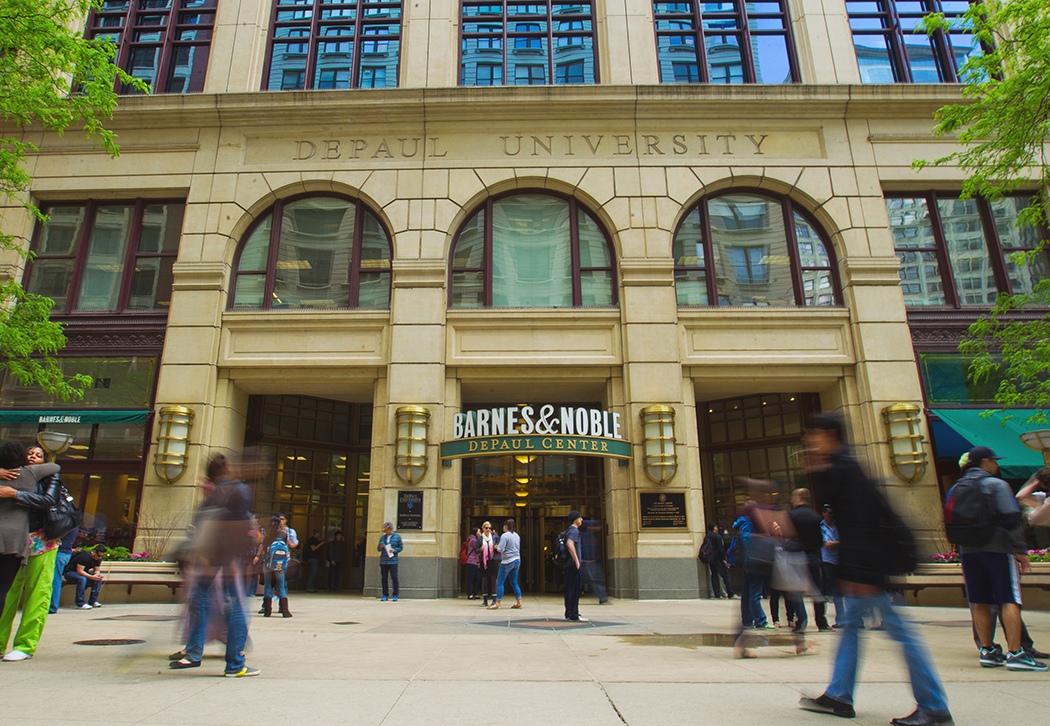 A view of an imposing, stone building in an urban setting. It reads DePaul Center